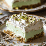 No-bake pistachio dessert slice on vintage plate